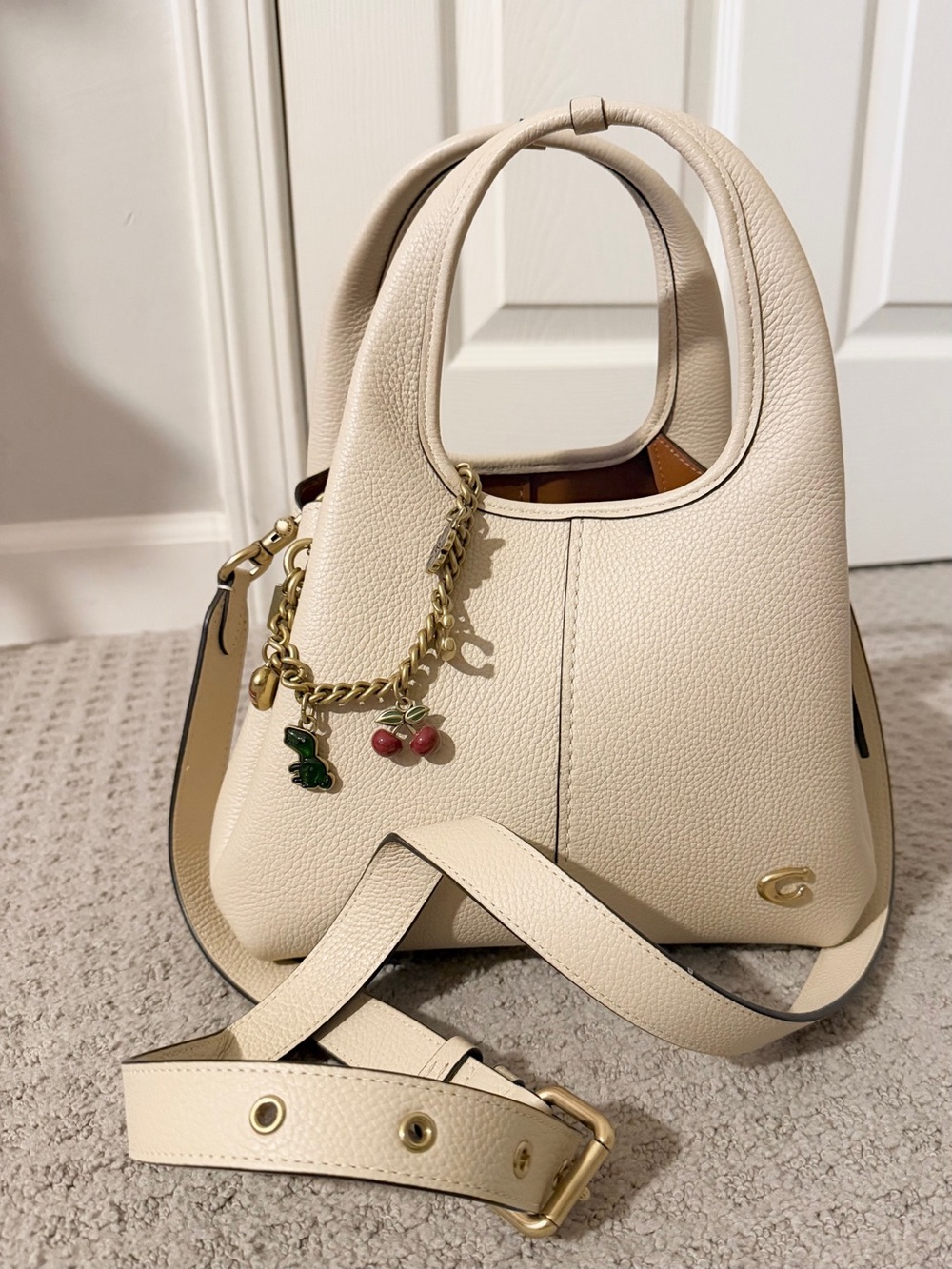 Ivory and gold Coach Lana Shoulder bag 23 with charm